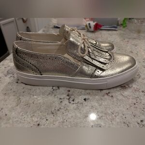 1901 Parks Kiltie Sneakers in a metallic gold leather finish. Women's 10